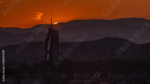 Sunset view of Sarajevo with tallest skyscraper from most popular panoramic spot in Sarajevo timelapse. Road near Yellow Fortress (Zuta Tabija), Vratnik photo