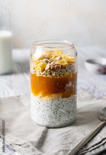 granola in a transparent glass with yogurt close-up