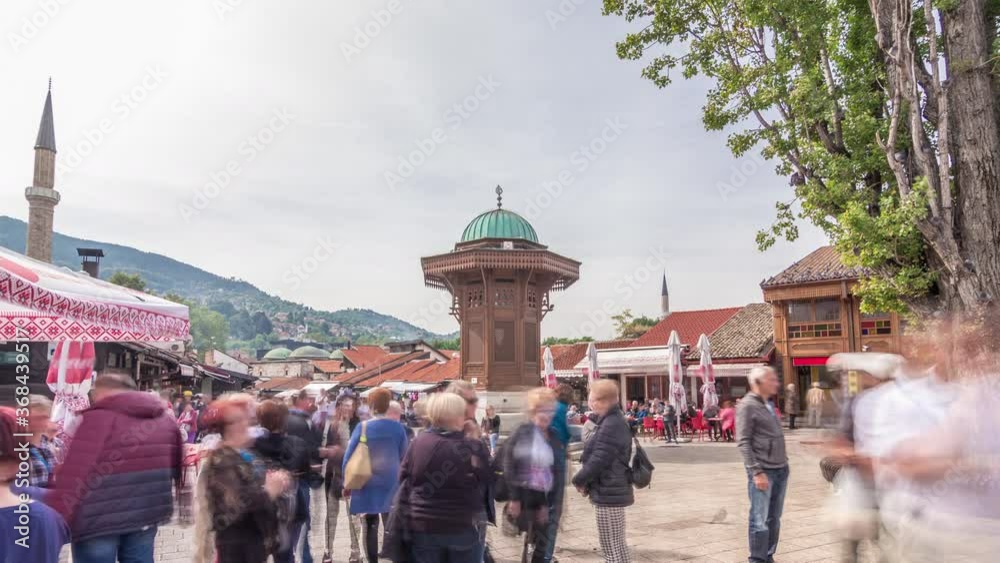 The Sebilj fountain in Sarajevo old city in Bosnia and Herzegovina timelapse hyperlapse. The Sebilj fountain is an Ottoman style wooden fountain in the centre square in Sarajevo