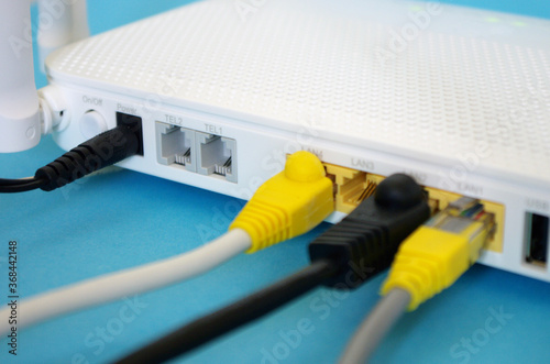 Fiber Optic Internet. Network cables Connected to a router, speed test concept. Wireless internet router with connected cables, internet Security.