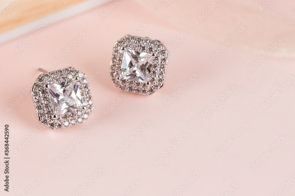 Close up of diamond earrings. space for your text. Close up of diamond earrings. space for your text.
