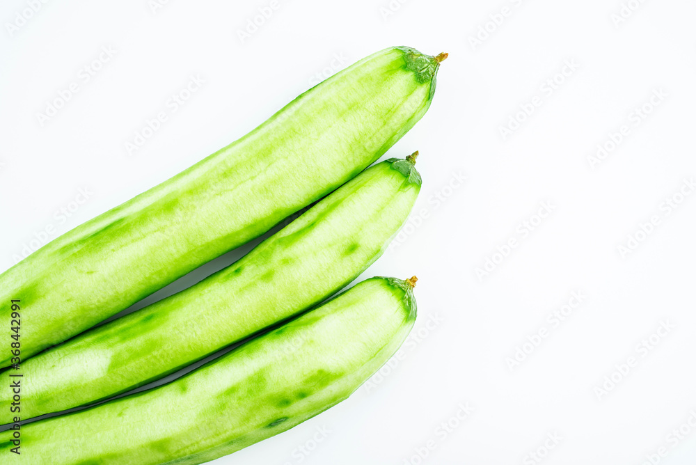 Fresh peeled loofah on white background Fresh peeled loofah on white background