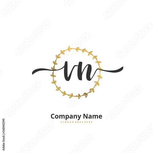 V N VN Initial handwriting and signature logo design with circle. Beautiful design handwritten logo for fashion, team, wedding, luxury logo. photo