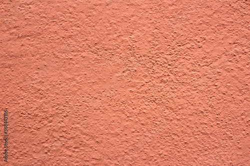 Peachy rough wall. Orange background.