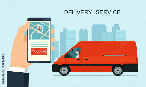 Delivery service app on smartphone. Cargo van and delivery worker in medical mask. Tracking an order using his smartphone. Abstract cityscape in the background. Concept for logistics and technology.