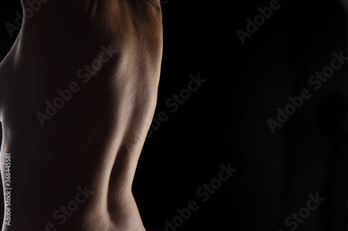 middle aged woman back on black background