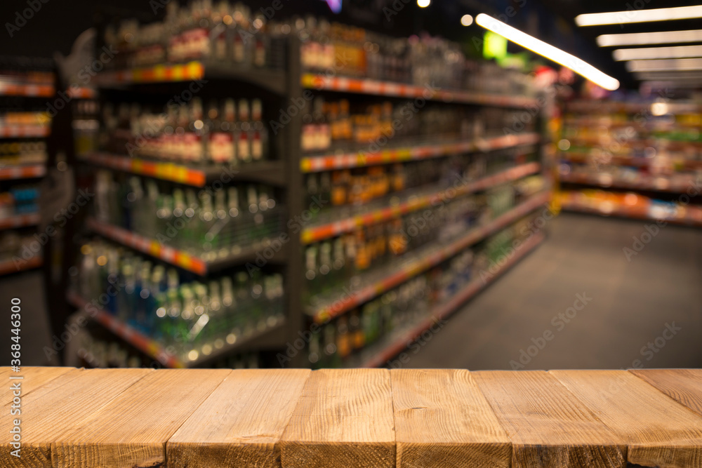 Wood top table on blur supermarket background