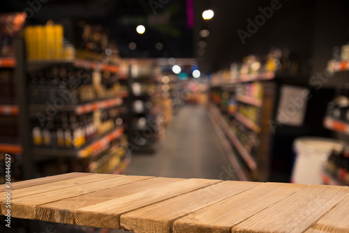 Wood top table on blur supermarket background © kishivan