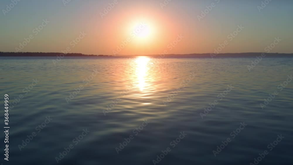 Sunset in the river with calm water surface Sunset in the river with calm water surface