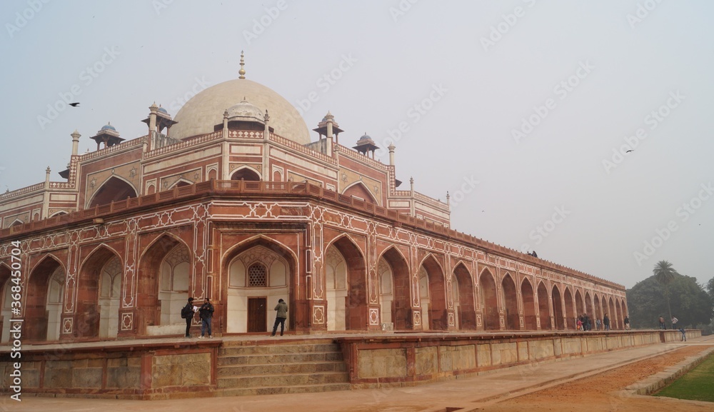 Humayun's Tomb,Delhi; A mousoleum made of red and white sandstone with arches,domes and canopies.