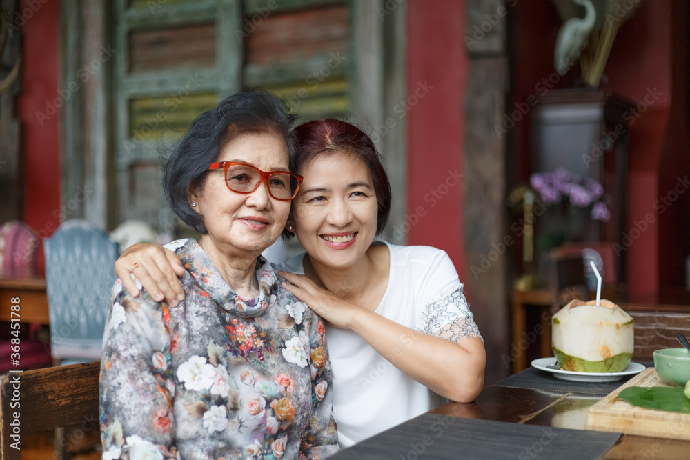 Senior asian woman with daughter relaxing on vacation together in mothers day. Senior asian woman with daughter relaxing on vacation together in mothers day.