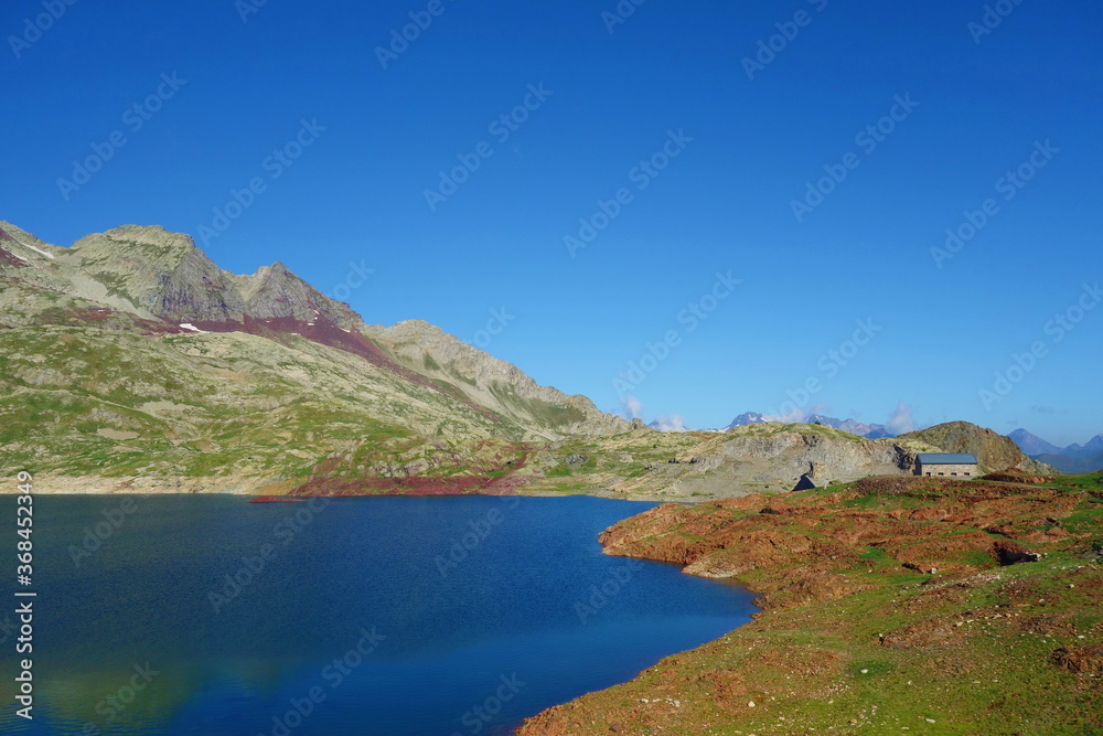 Mountain lake called Urdiceto in Pyrenees mountains on a long-distance hiking trail GR11 in Spain