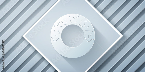 Paper cut Donut with sweet glaze icon isolated on grey background. Paper art style. Vector Illustration.