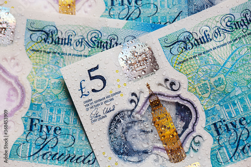  British currency - close up of the new 2016 polymer five pound note with enhanced counterfeit resilience.