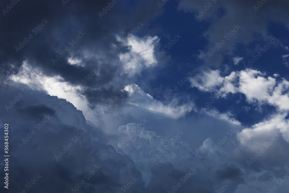 Fototapeta premium Black cloud and thunderstorm before rainy, Dramatic black clouds and dark sky