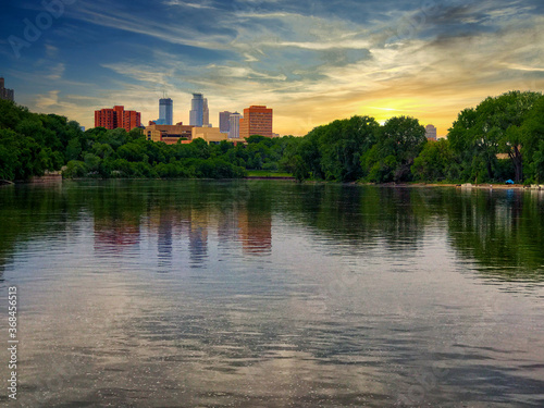 An agreeable sunset scene of the Minneapolis skyline taken near the University of Minnesota campus on the Mississippi river.