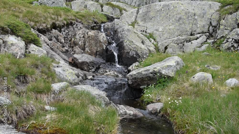 Landscape with stones and a small mountain stream in French Alps Landscape with stones and a small mountain stream in French Alps