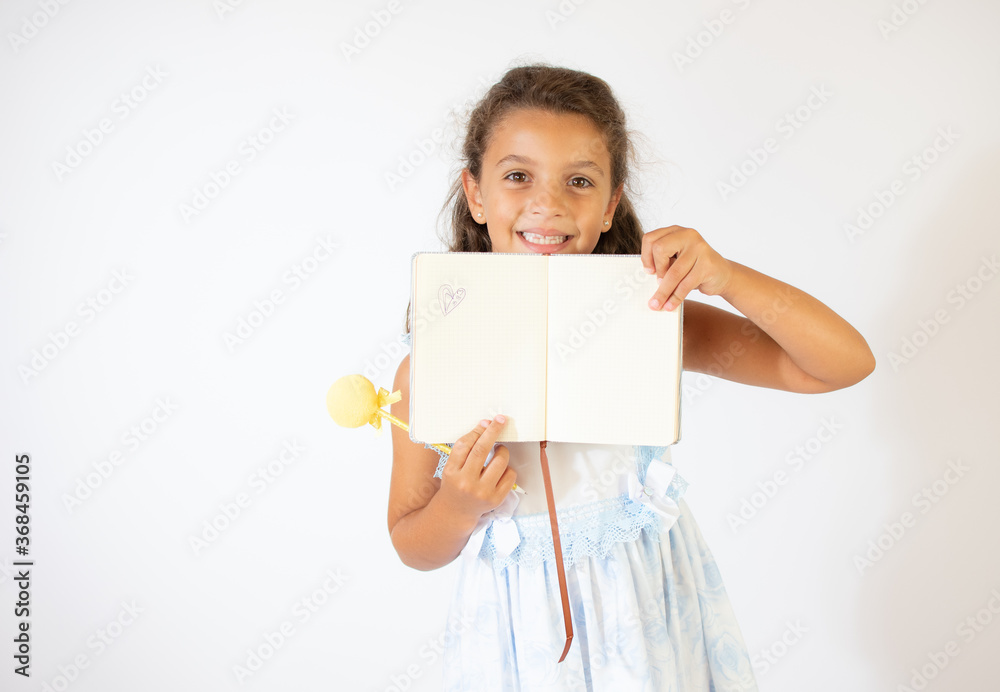 Beautiful girl in blue dress smiling on white background Beautiful girl in blue dress smiling on white background