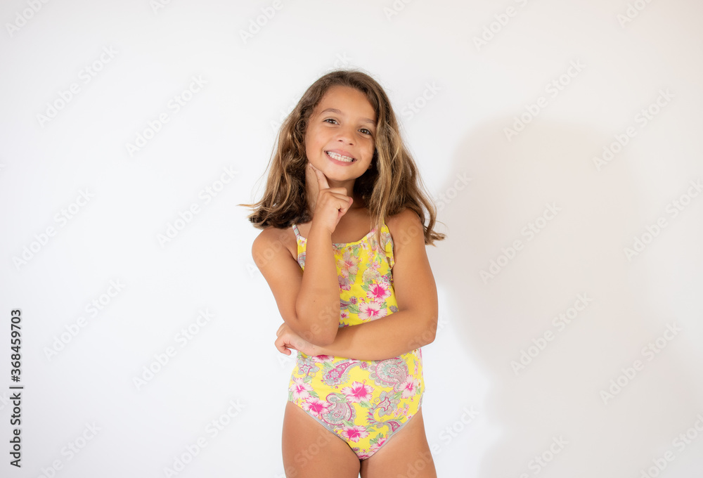 Obraz premium Beautiful girl in colorful swimsuit smiling