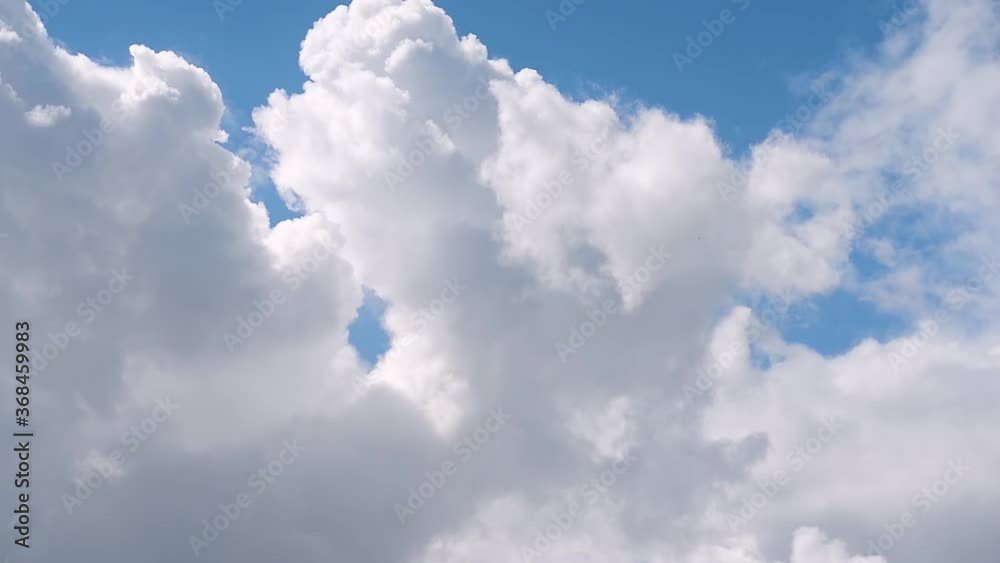 Timelapse of Cumulus cloud formation on a clear summer day close up Timelapse of Cumulus cloud formation on a clear summer day close up