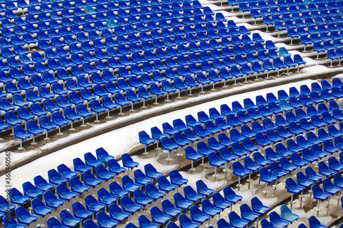 Blue seats in a stadium. Plastic seats, open air theatre 