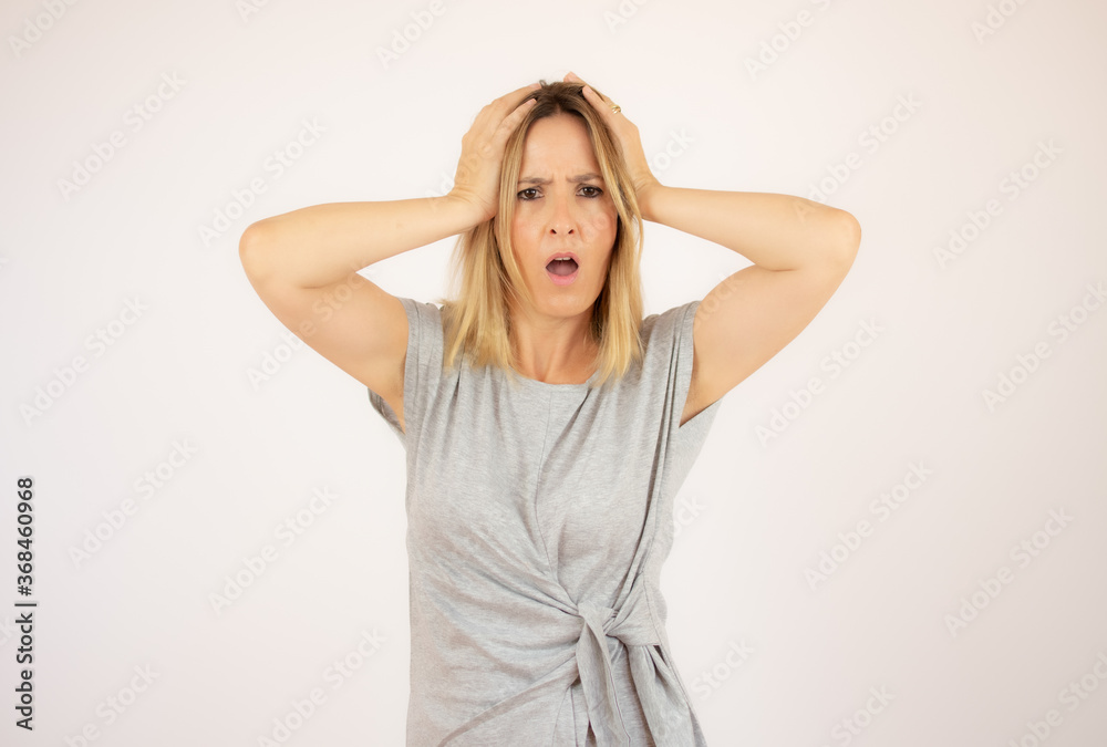 Beautiful woman in grey dress on white background Beautiful woman in grey dress on white background