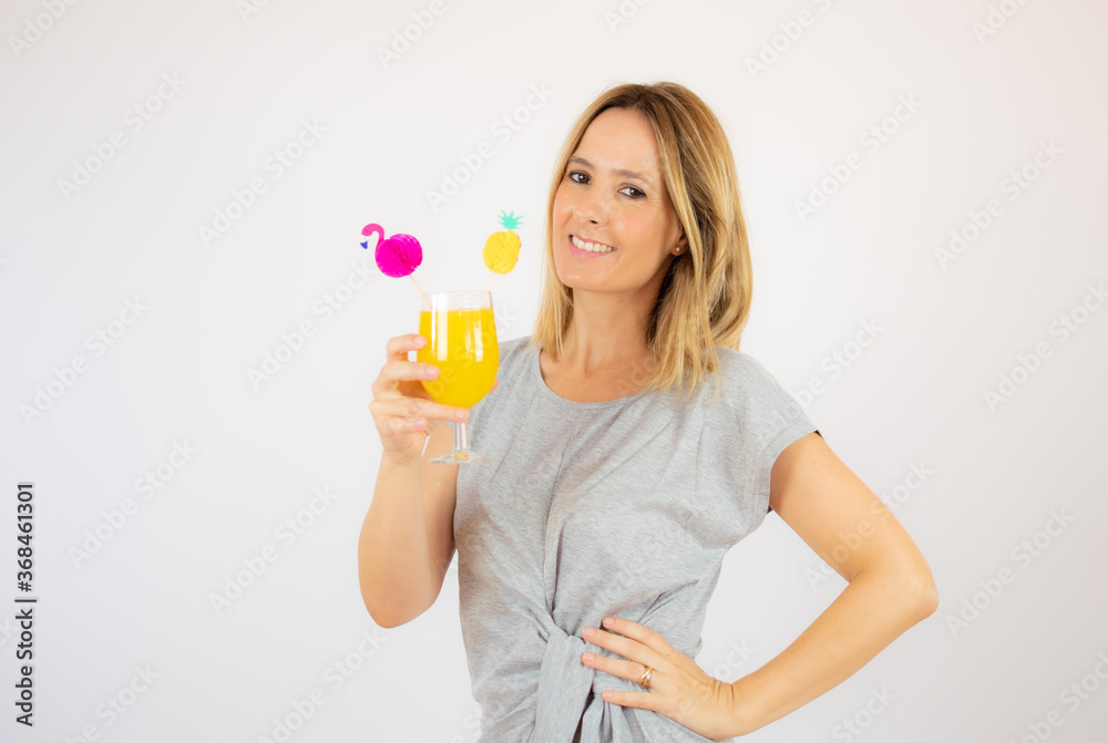 Beautiful woman in grey dress with a cocktail Beautiful woman in grey dress with a cocktail