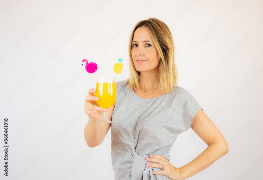 Beautiful woman in grey dress with a cocktail Beautiful woman in grey dress with a cocktail