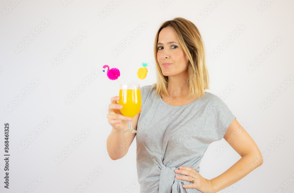 Beautiful woman in grey dress with a cocktail Beautiful woman in grey dress with a cocktail