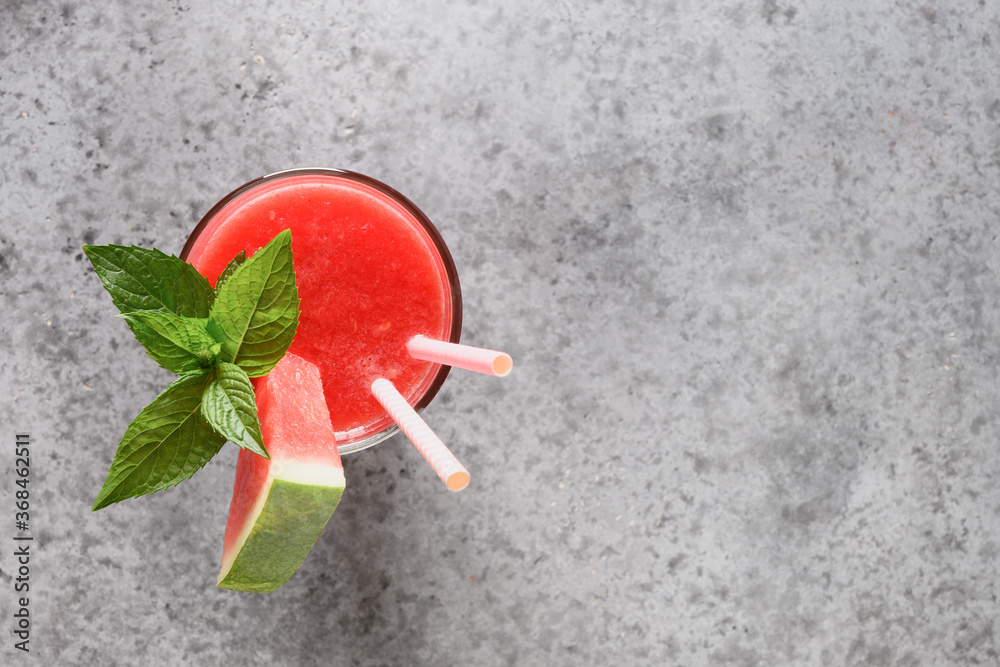 Watermelon cocktail garnish mint on grey stone table. View from above. Copy space. Watermelon cocktail garnish mint on grey stone table. View from above. Copy space.