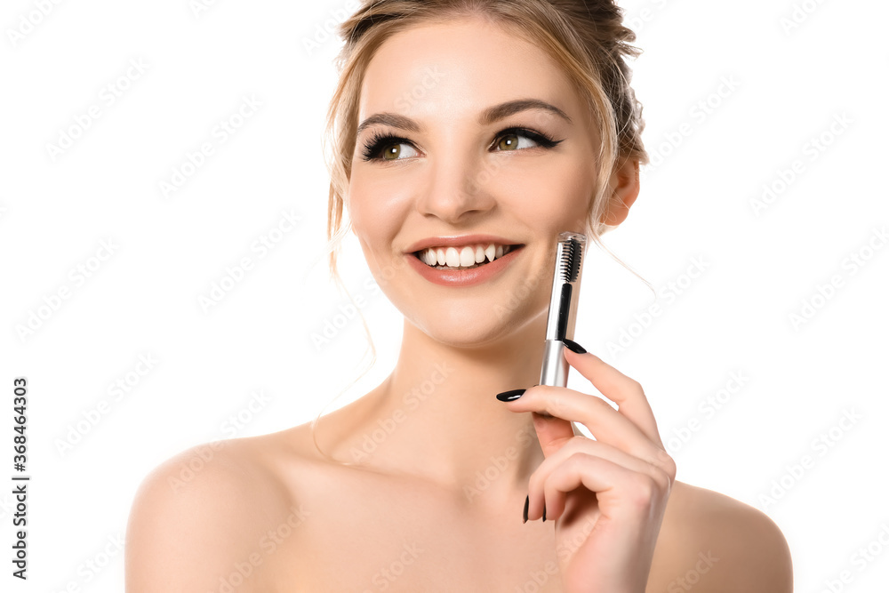 smiling naked beautiful blonde woman holding clear brow gel isolated on white