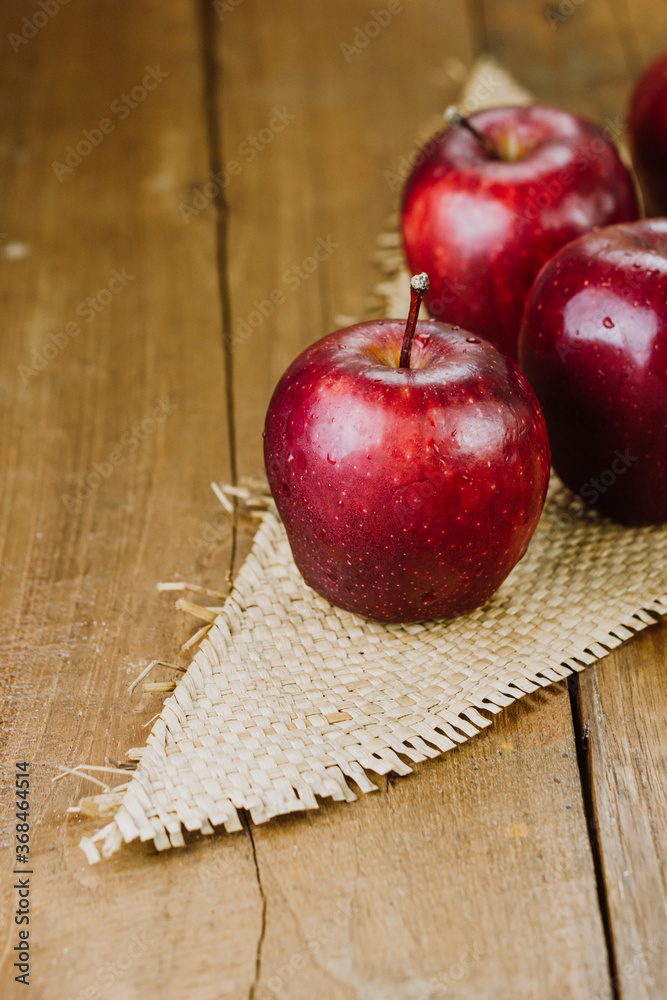 apple on a wooden table apple on a wooden table