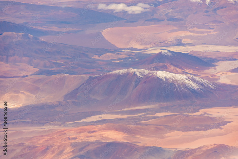 Aerial view of snow capped volcanic peaks in the Atacama Desert, Chile
