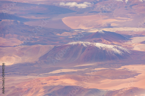 Aerial view of snow capped volcanic peaks in the Atacama Desert, Chile