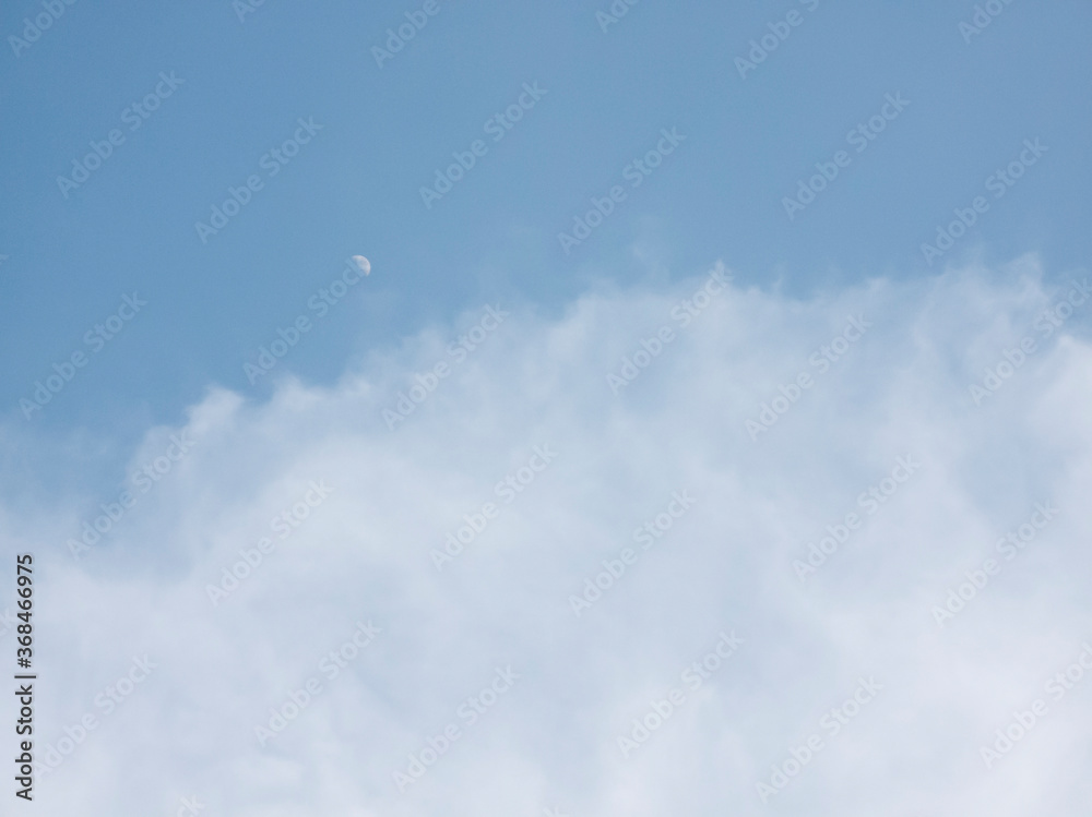 soft white clouds on blue sky background.