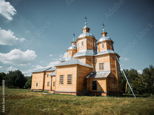 Reconstructed ancient wooden church in Pirogovo in Kiev, Ukraine photo