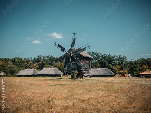 The traditional ukrainian wooden wind mill in the Pirogovo historical museum  Kiev  Ukraine