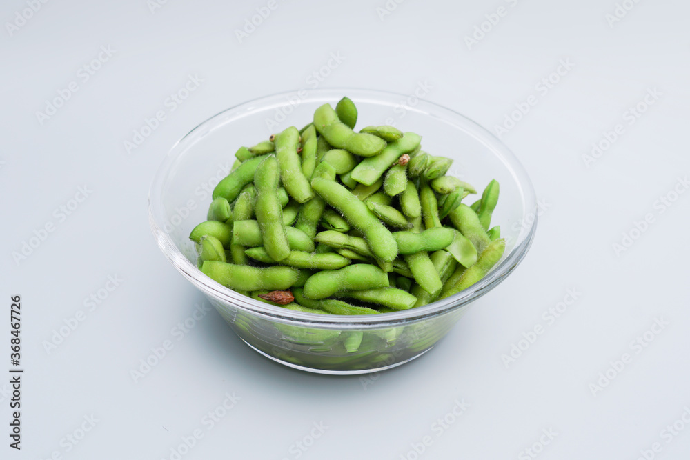 A traditional Chinese delicacy in solid color, boiled soybeans in brine. Chinese traditional food boiled soybean. A traditional Chinese delicacy in solid color, boiled soybeans in brine. Chinese traditional food boiled soybean.