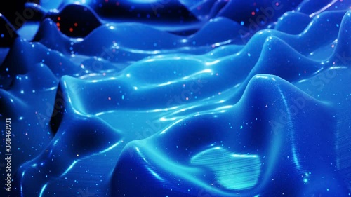 fantastical festive blue bg. Stylish abstract looped background, waves move on glossy surface like landscape made of liquid blue wax with sparkles. Beautiful soft background with smooth animation 4k photo