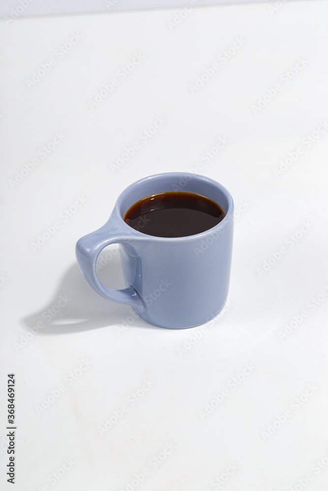 blue cup with black coffee on a white background blue cup with black coffee on a white background