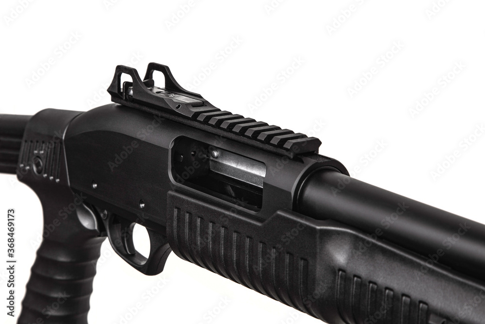 Modern pump action tactical shotgun isolate on a white background. Armament of the police, army and special units. Weapons for sports and self-defense