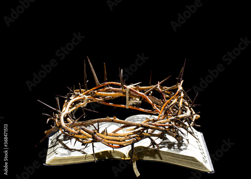 Fototapeta The crown of thorns lies on the open book of the Bible