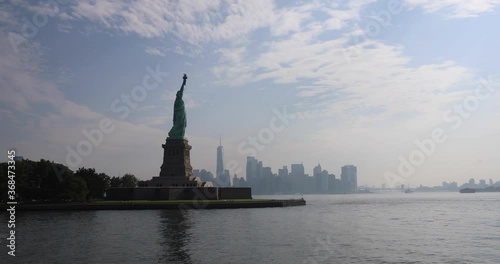 Passing Statue Of Liberty With Manhattan