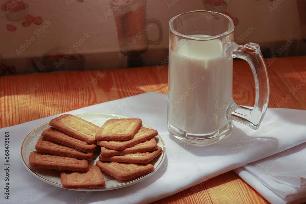 White milk cup with delicious coconut biscuit for breakfast White milk cup with delicious coconut biscuit for breakfast