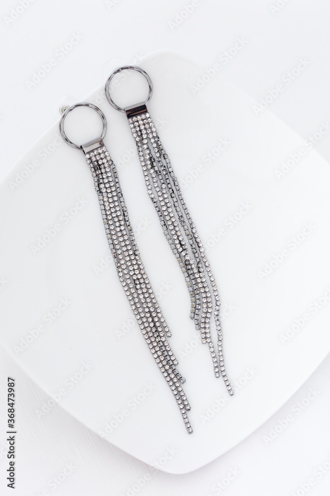 Close up of diamond earrings. space for your text. Close up of diamond earrings. space for your text.