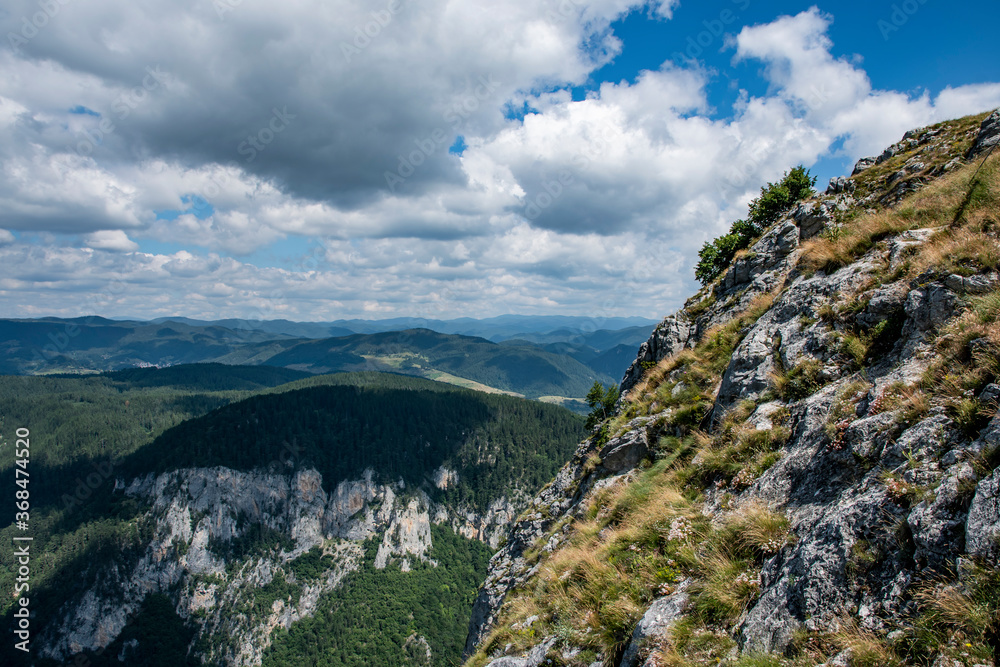 Green mountains in Bulgaria and blue sky with white clouds