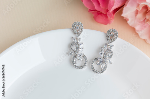 Close up of diamond earrings. space for your text.