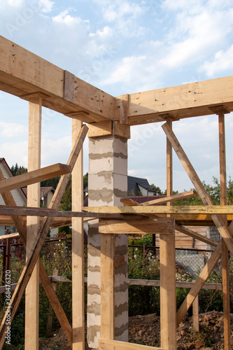 interior of a country house under construction. Site on which the walls are built of gas concrete blocks with wooden formwork