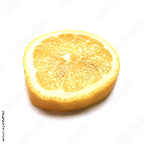 Slice of lemon citrus fruit on white background