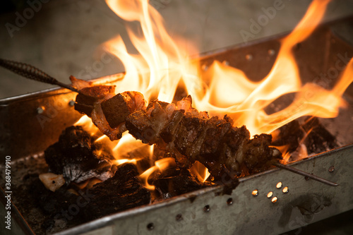 lighting coals for barbecue, open fire
